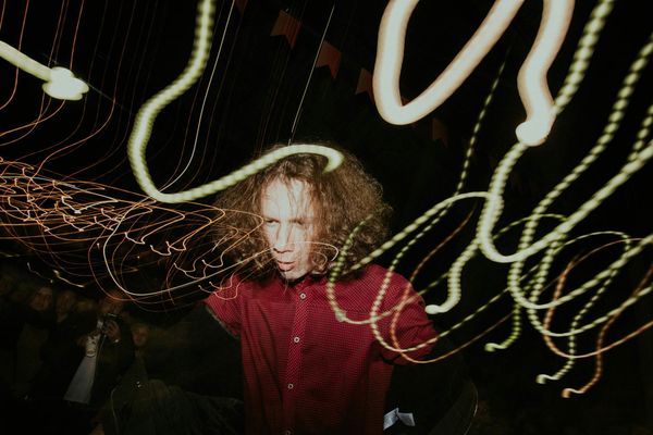 A person in motion, blurred to show dynamic movement.