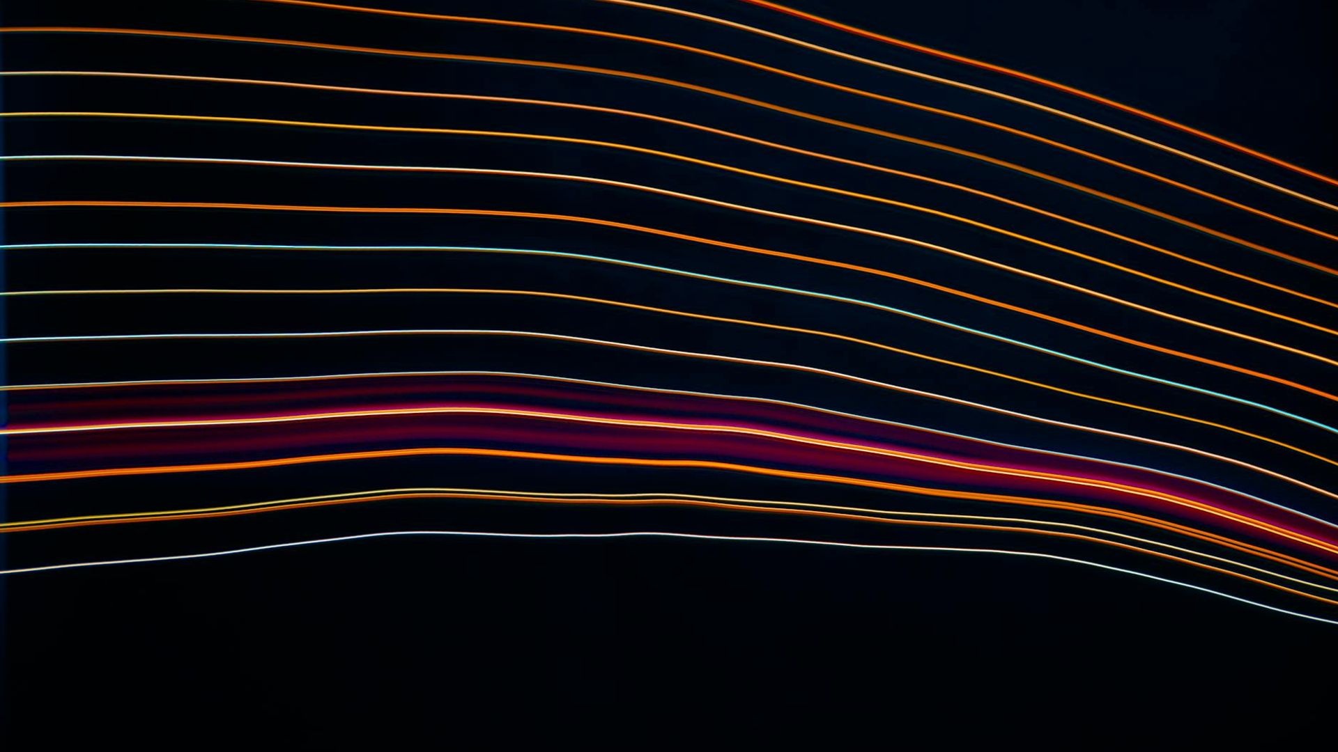 Abstract image with fluid lines of light representing energy and movement.